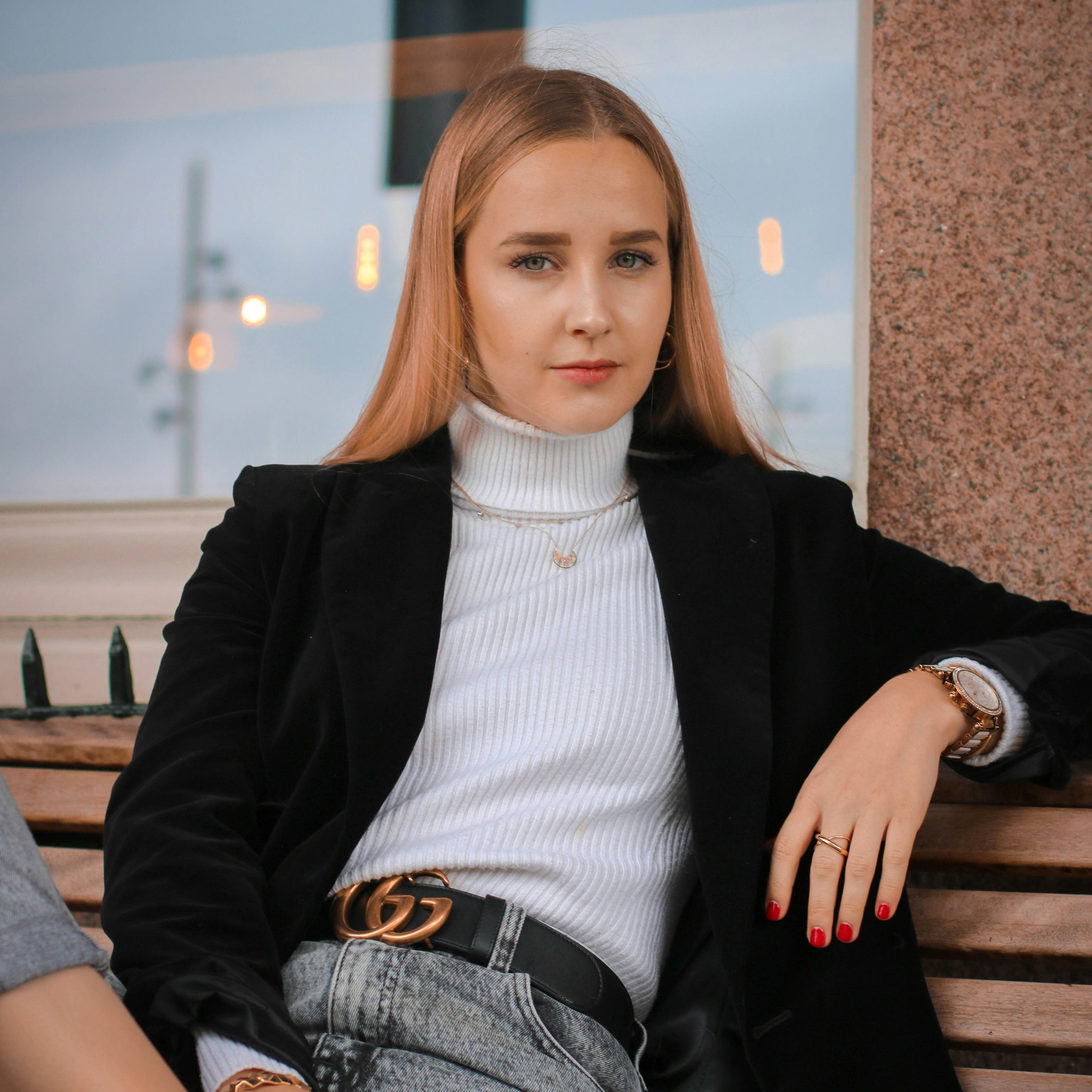 Portrait of a Girl on a bench in fornt of a reflecting window