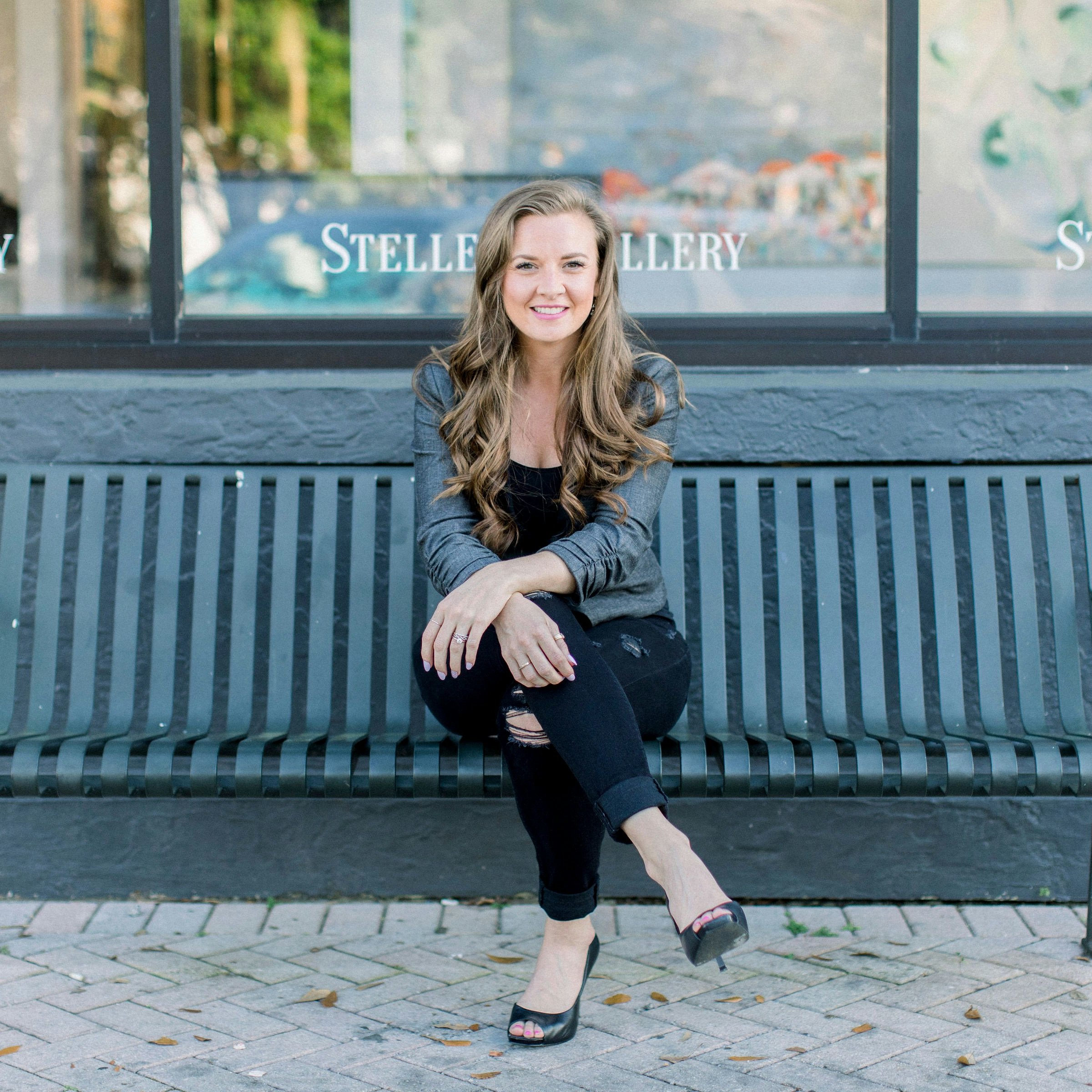 Businesswoman, young woman sitting on a bench, happy girl, smiling girl, smile. Young woman smiling. For more info on the model Alecia Safilippo @ PodMatch.com