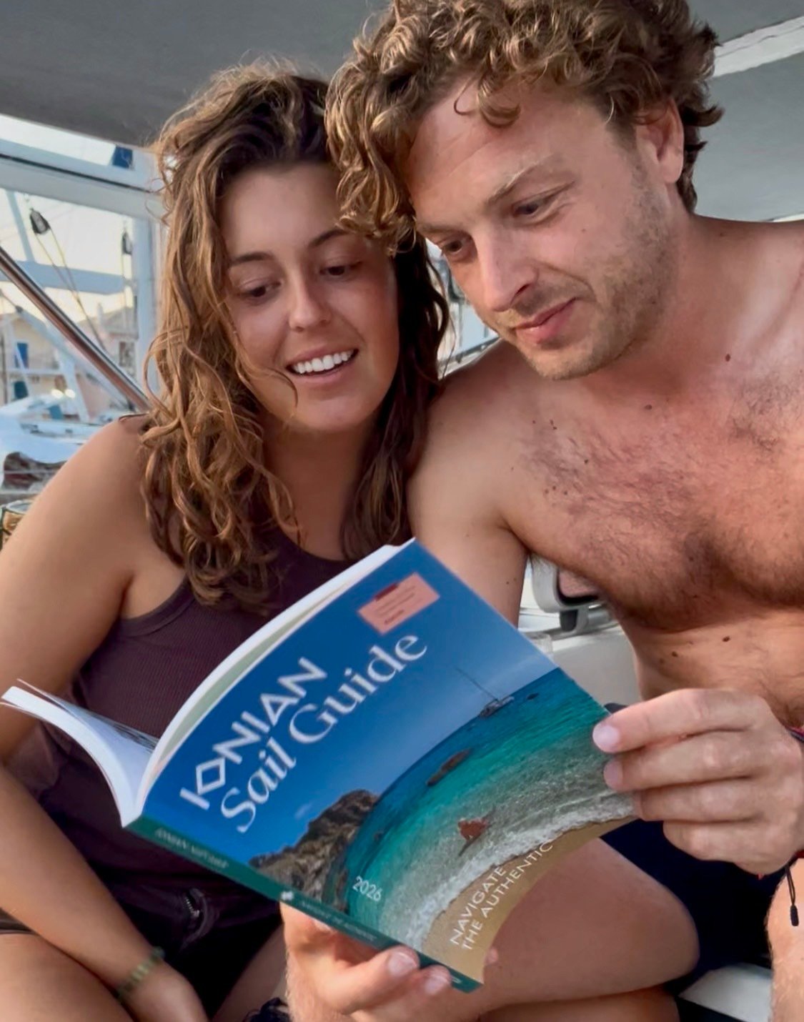 sailors using ionian sail guide preparing in lefkas