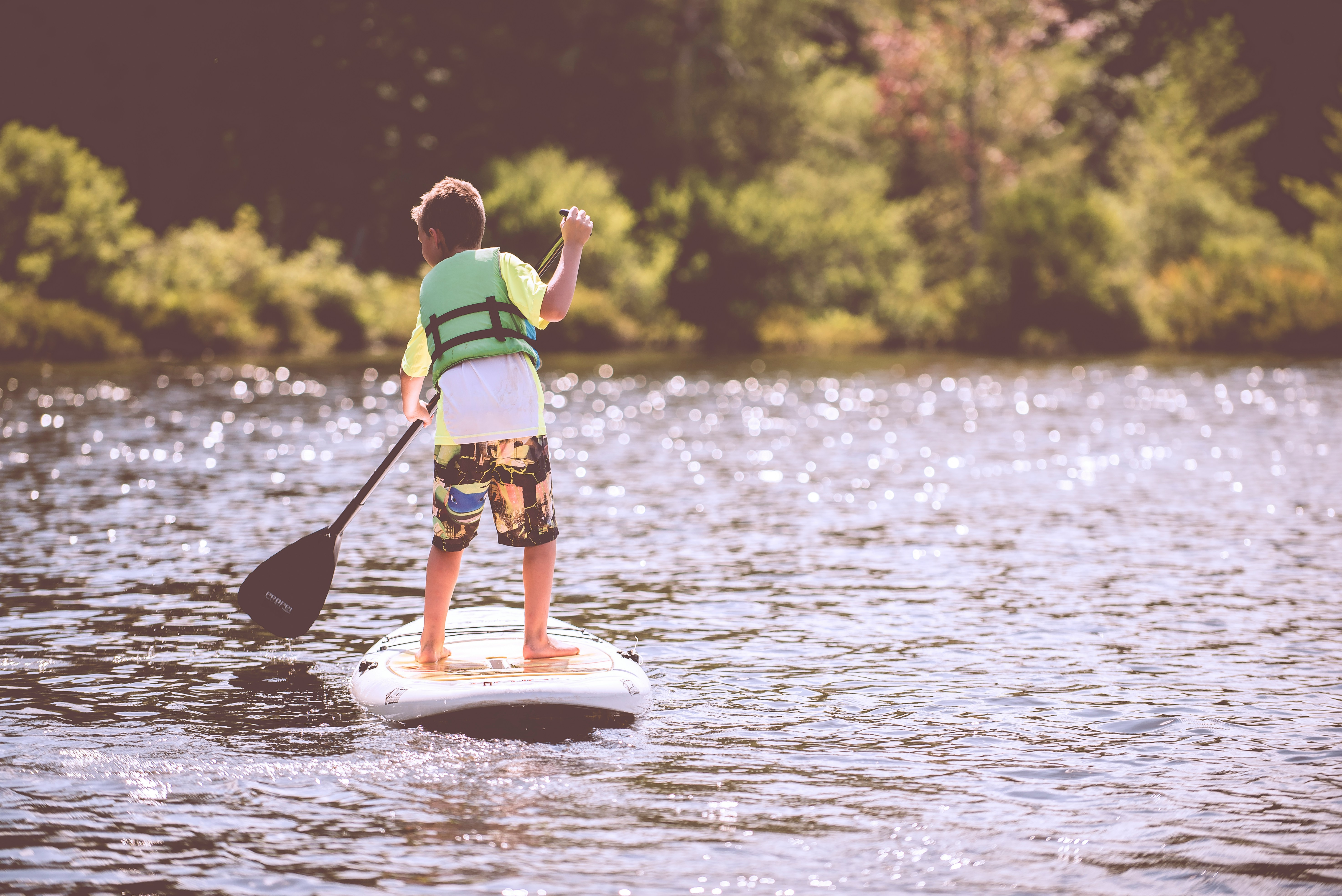 Boy paddleboarding