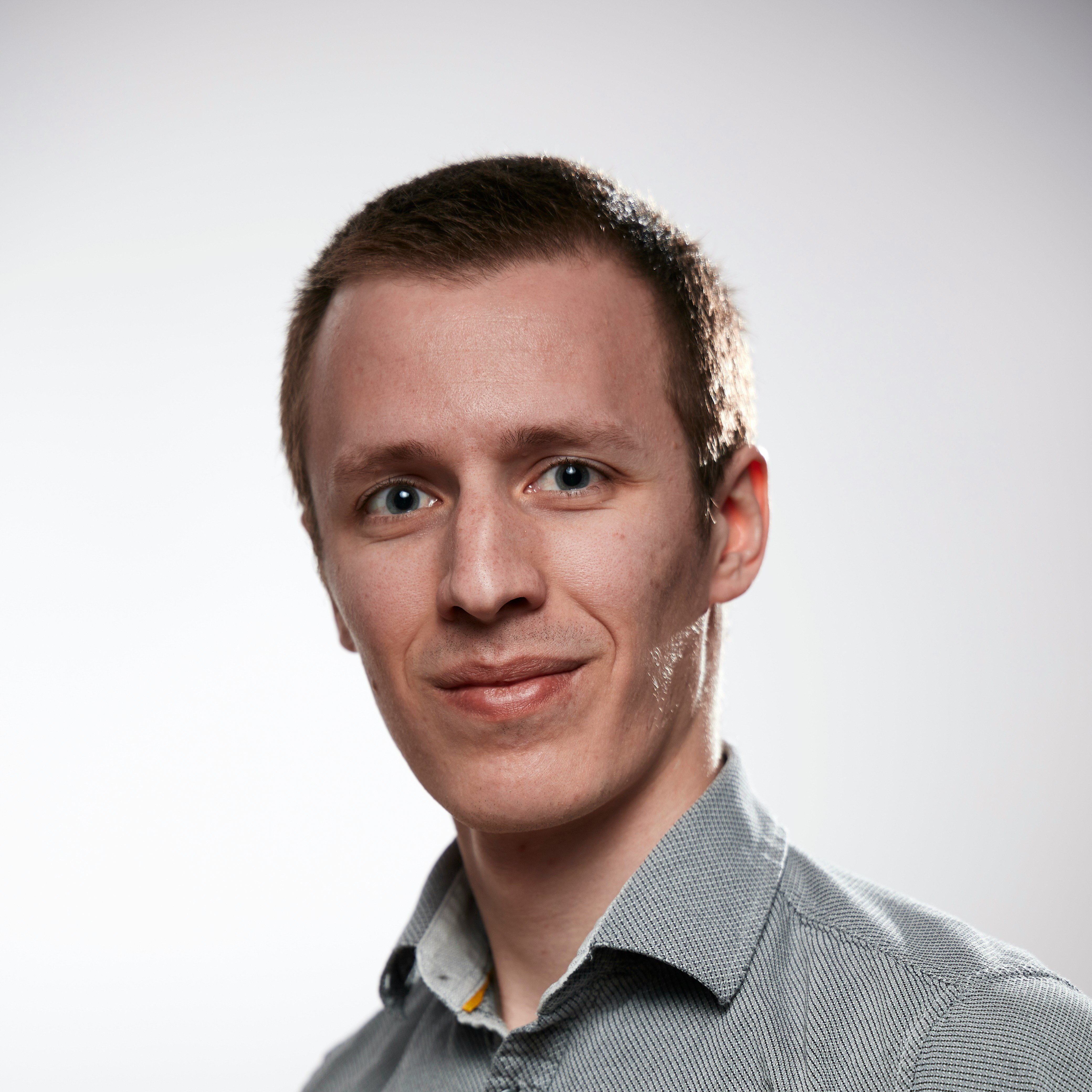 Portrait of a smiling man in clean cloths on a white background. Self portrait taken to test a brand new EOS RP.