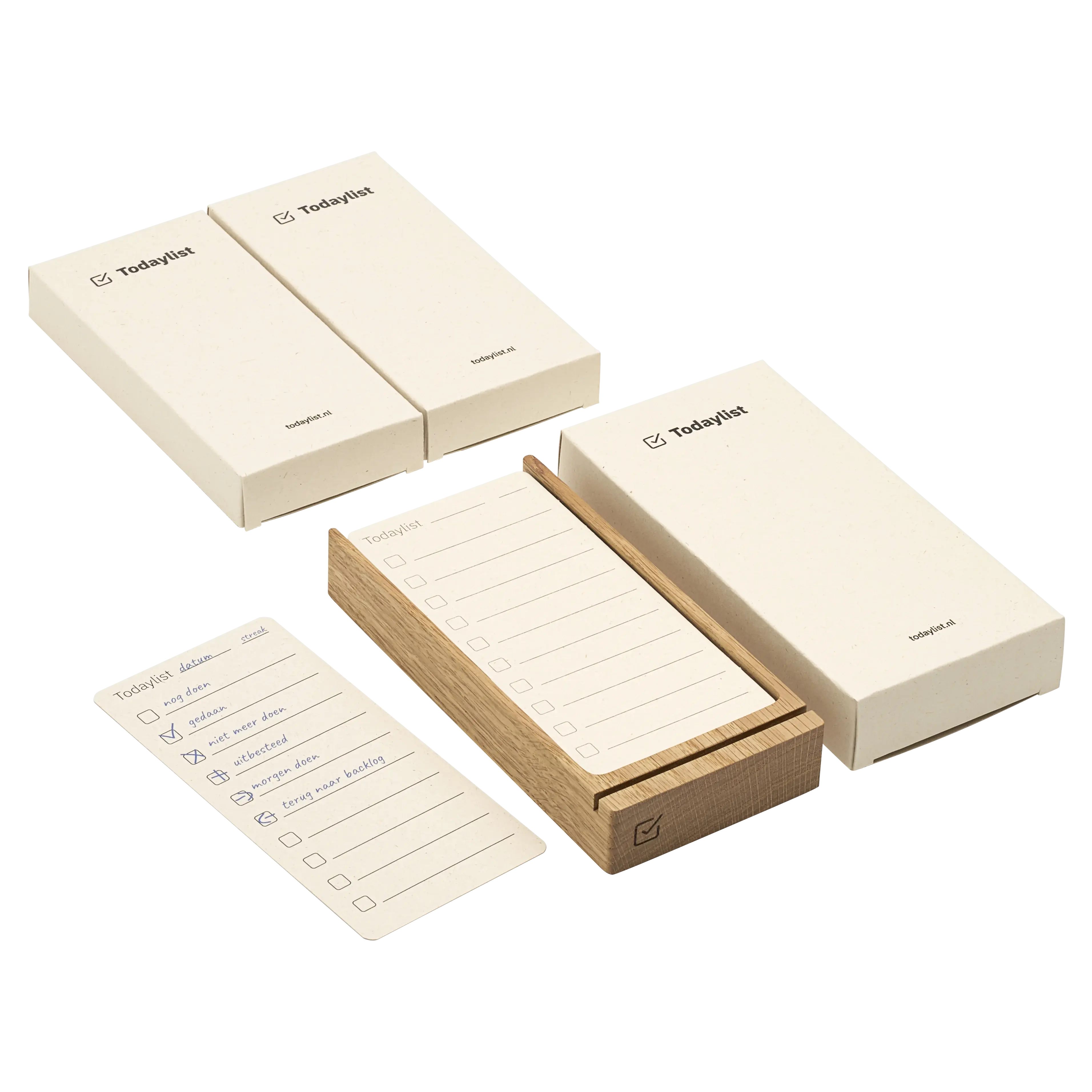 Een uitgebreide opstelling van het Todaylist systeem. Naast de eikenhouten bureauhouder en de handige statuskaart liggen hier drie stijlvolle beige Todaylist doosjes. Goed voor maandenlang tastbaar overzicht.