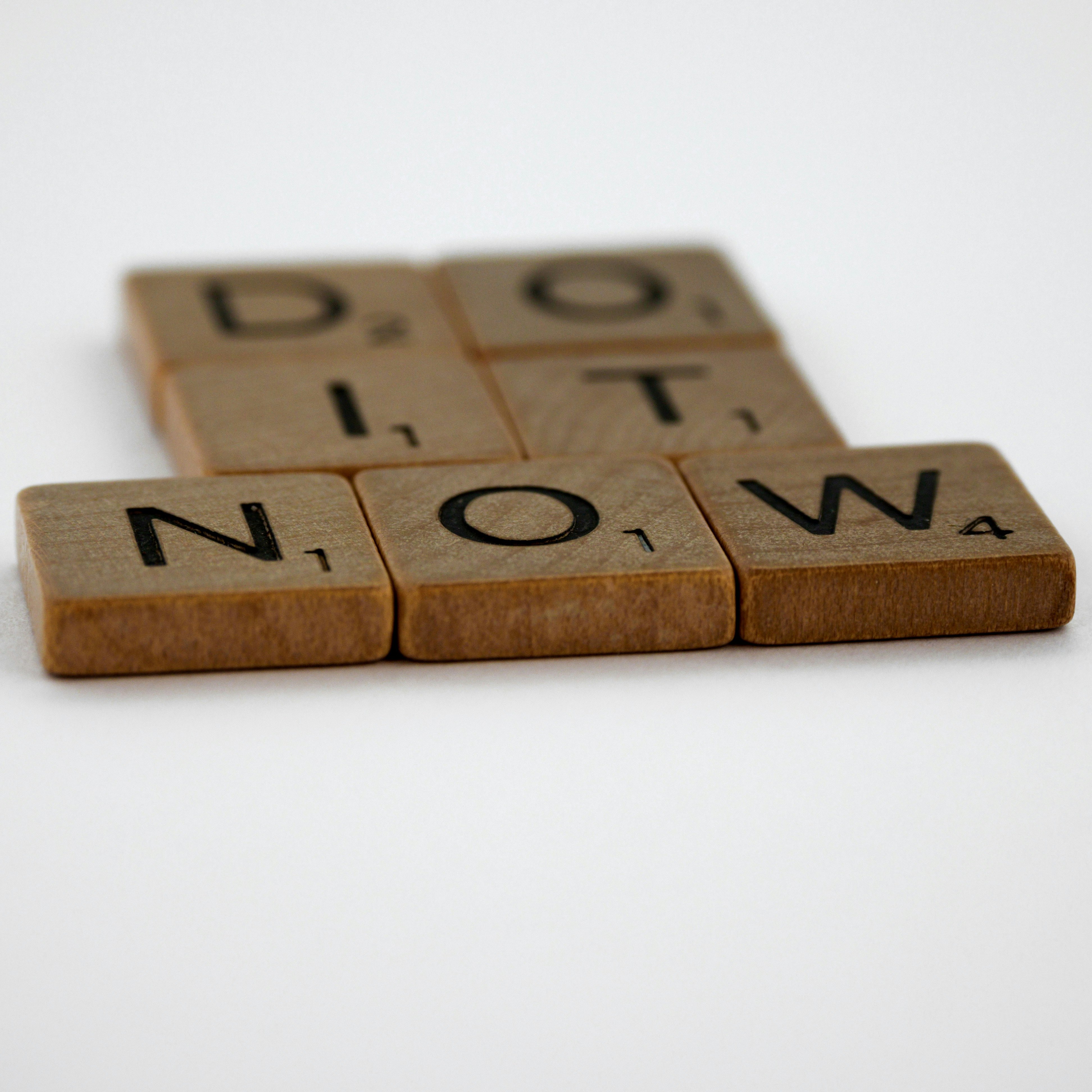 scrabble, scrabble pieces, lettering, letters, wood, scrabble tiles, white background, words, quote, letters, type, typography, design, layout, focus, bokeh, blur, photography, images, image, do it now, yolo, carpe diem, seize the moment, don't delay, don
