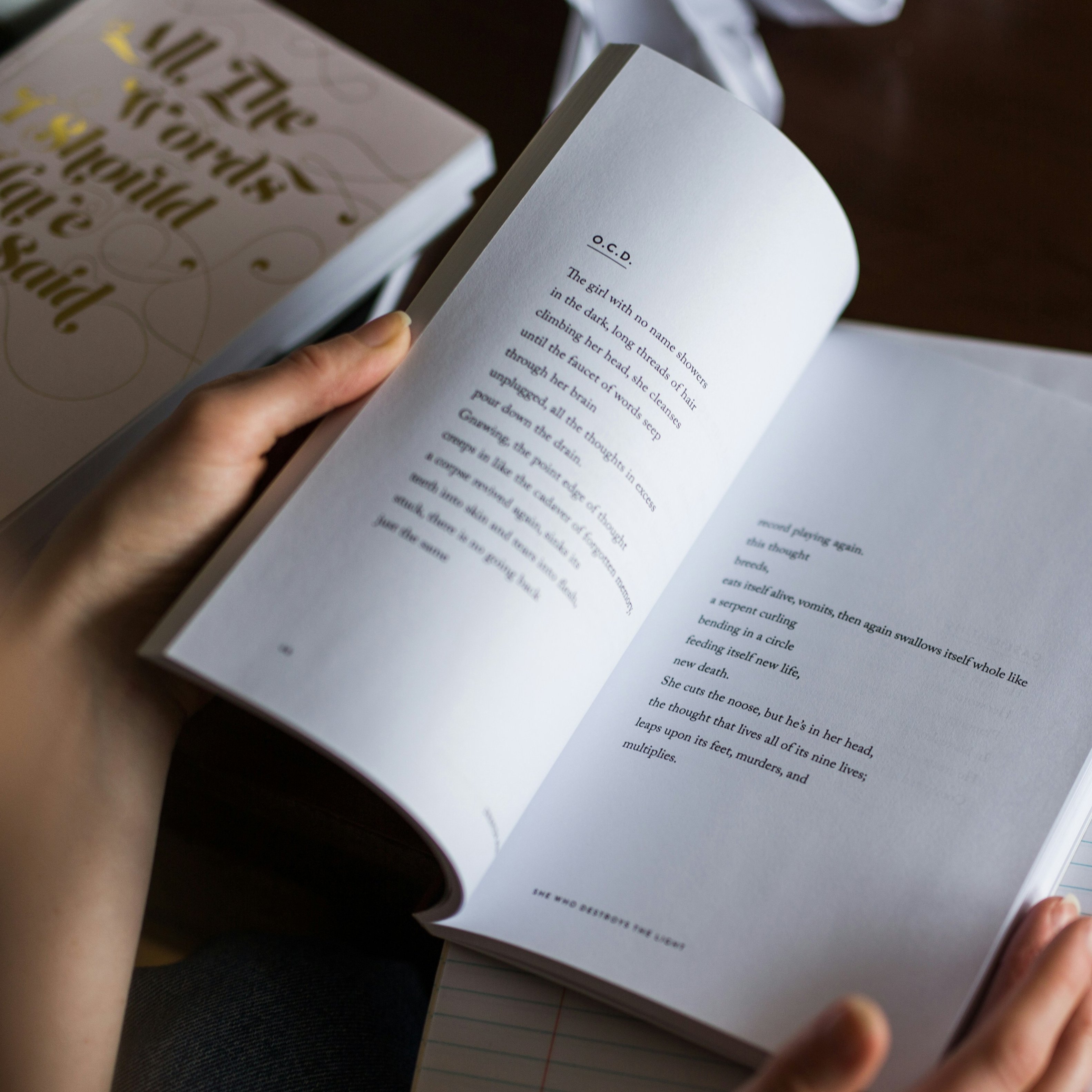 Young person reads poetry book