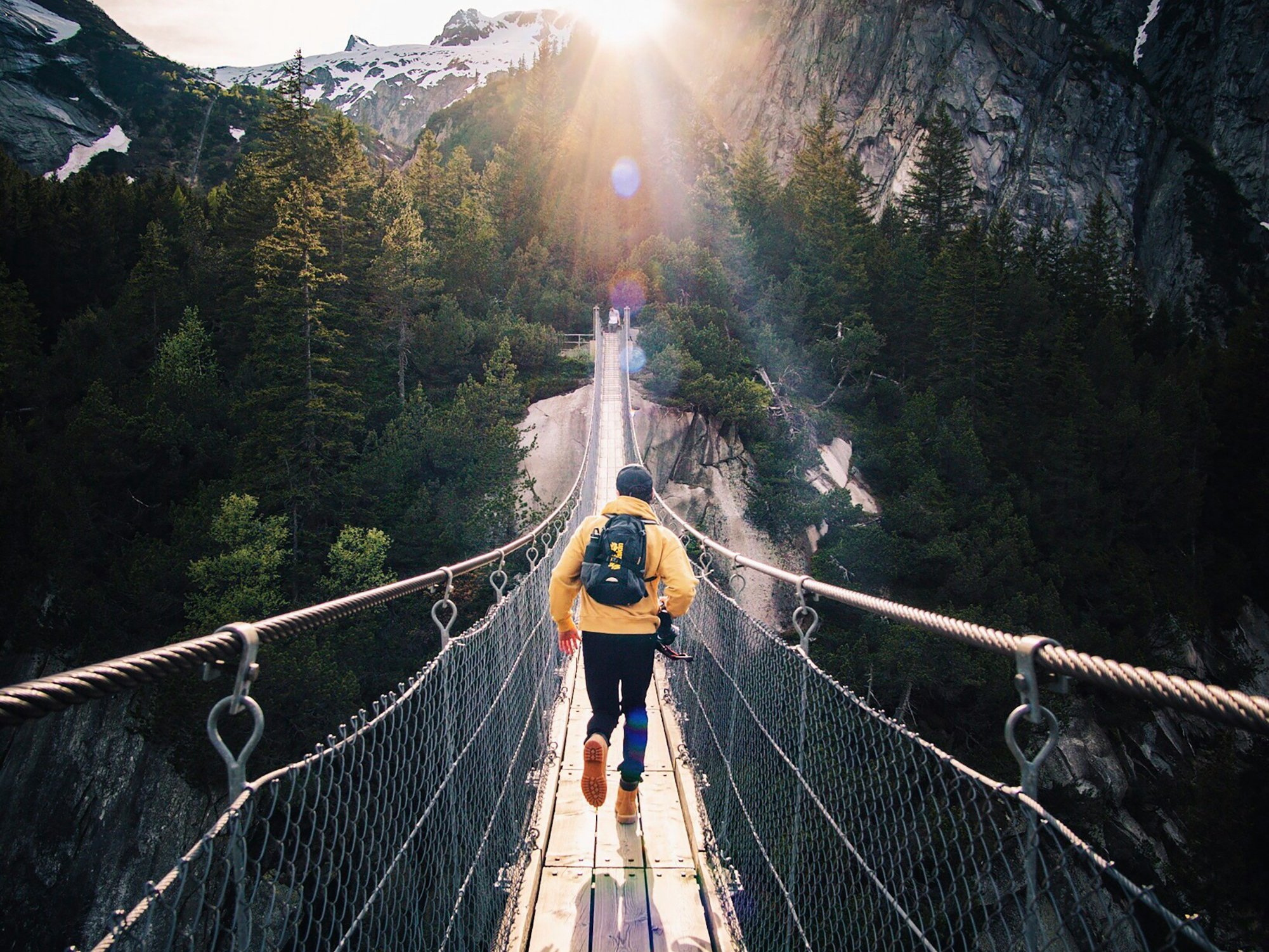 We were at this beautiful brige in murren , in the bernese Oberlan in switzerland with some friend, when i tell my friend to run like if he would catch the last ray.