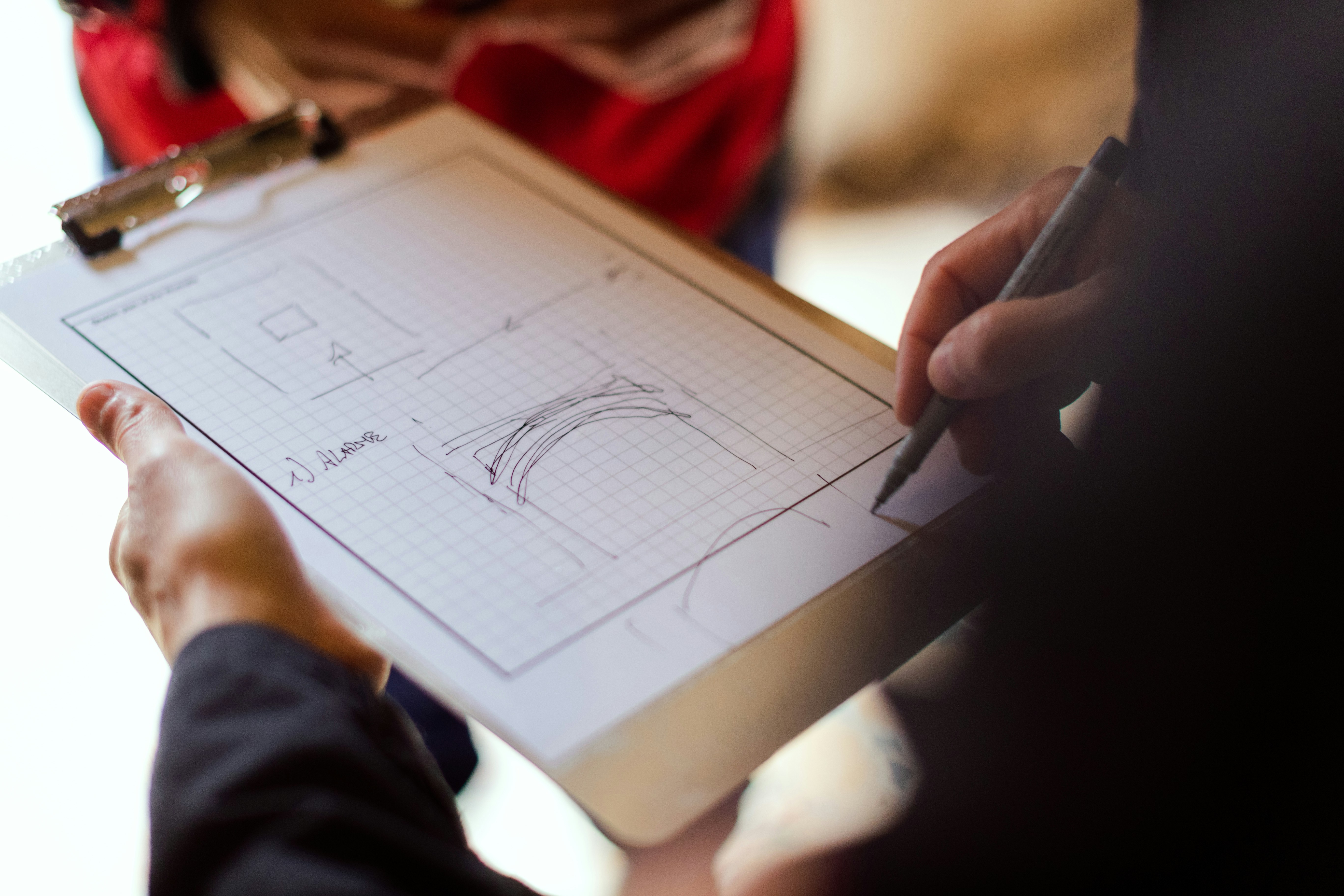 Structural engineer draws diagram to explain safe routes in earthquake site