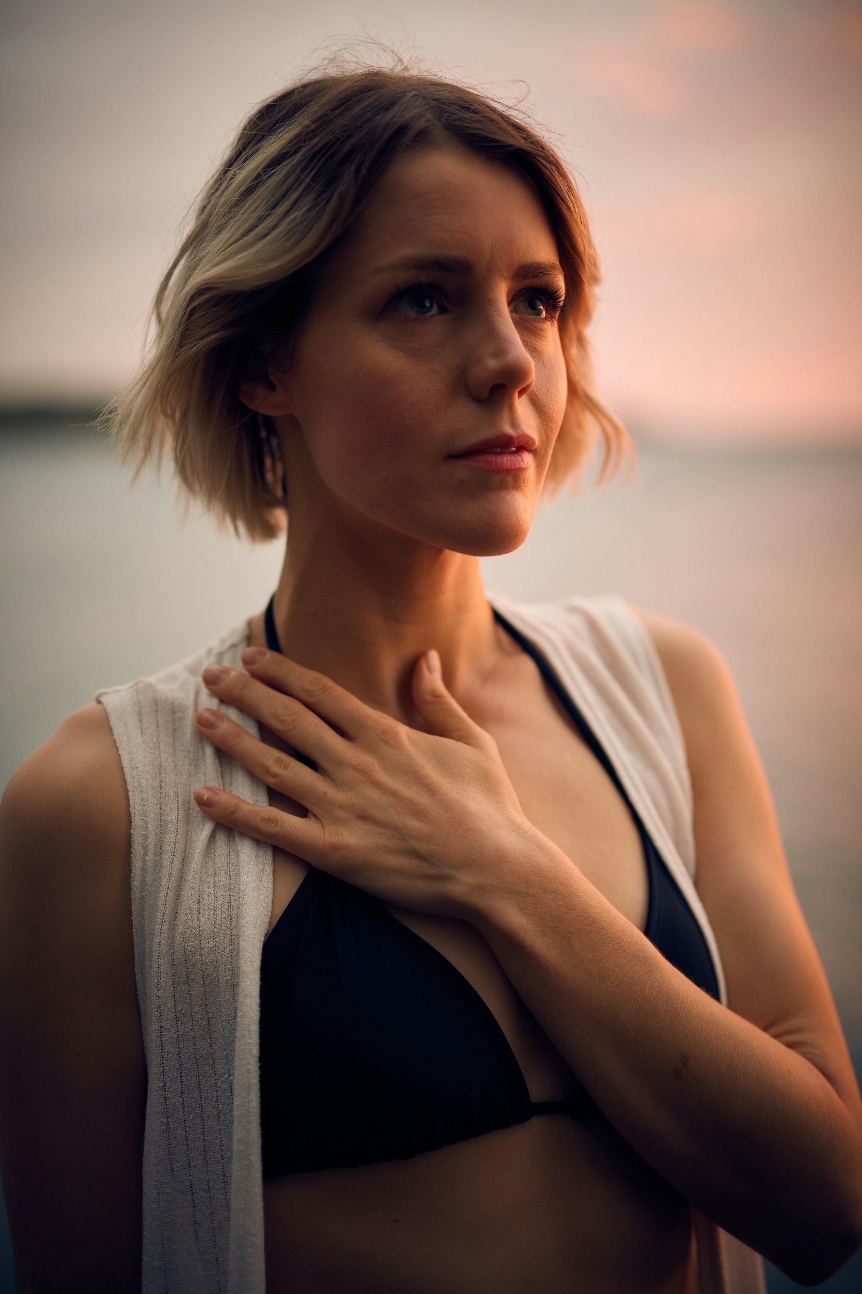 Beautiful blonde woman honoring her heart.