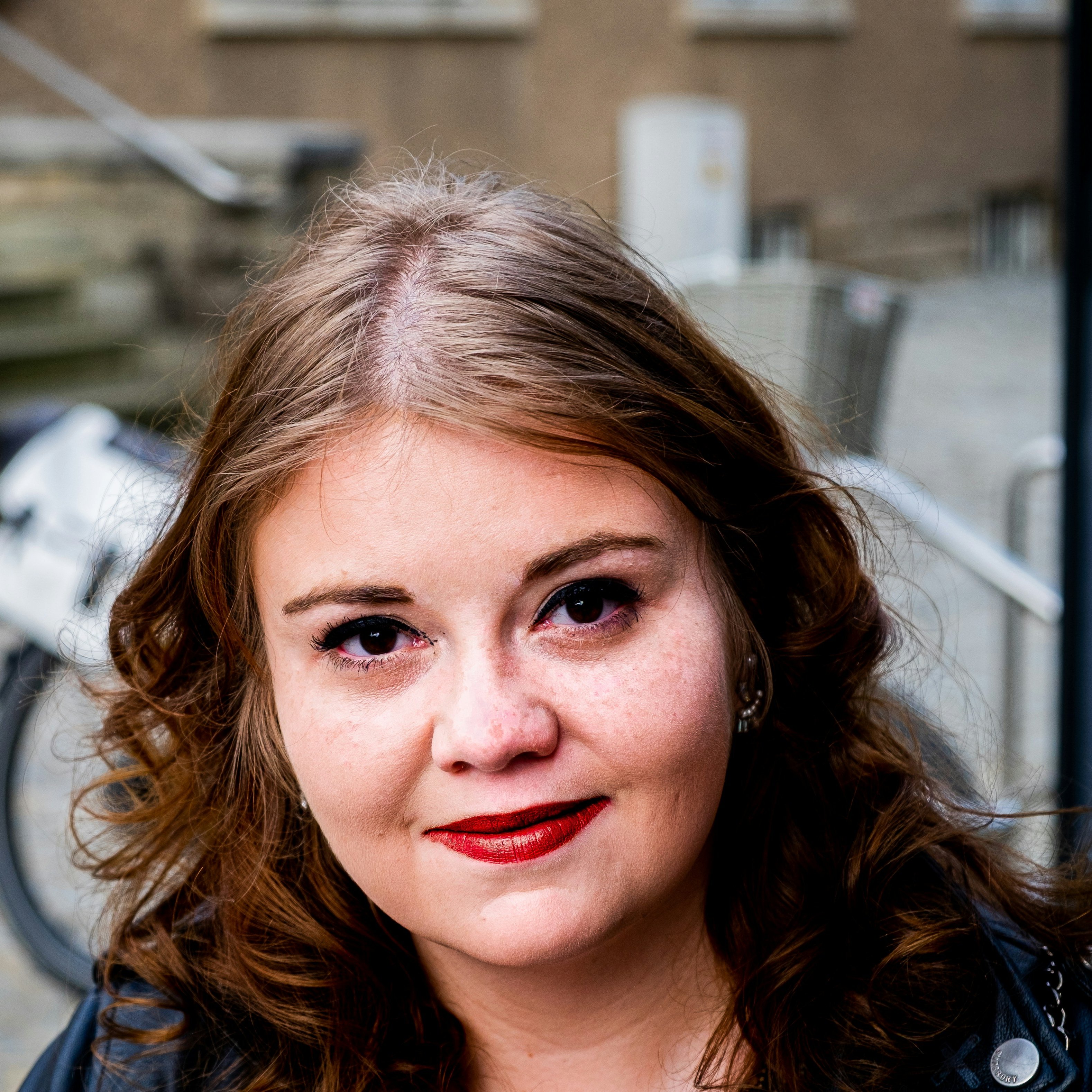 Portrait shot of a guest before a wedding.