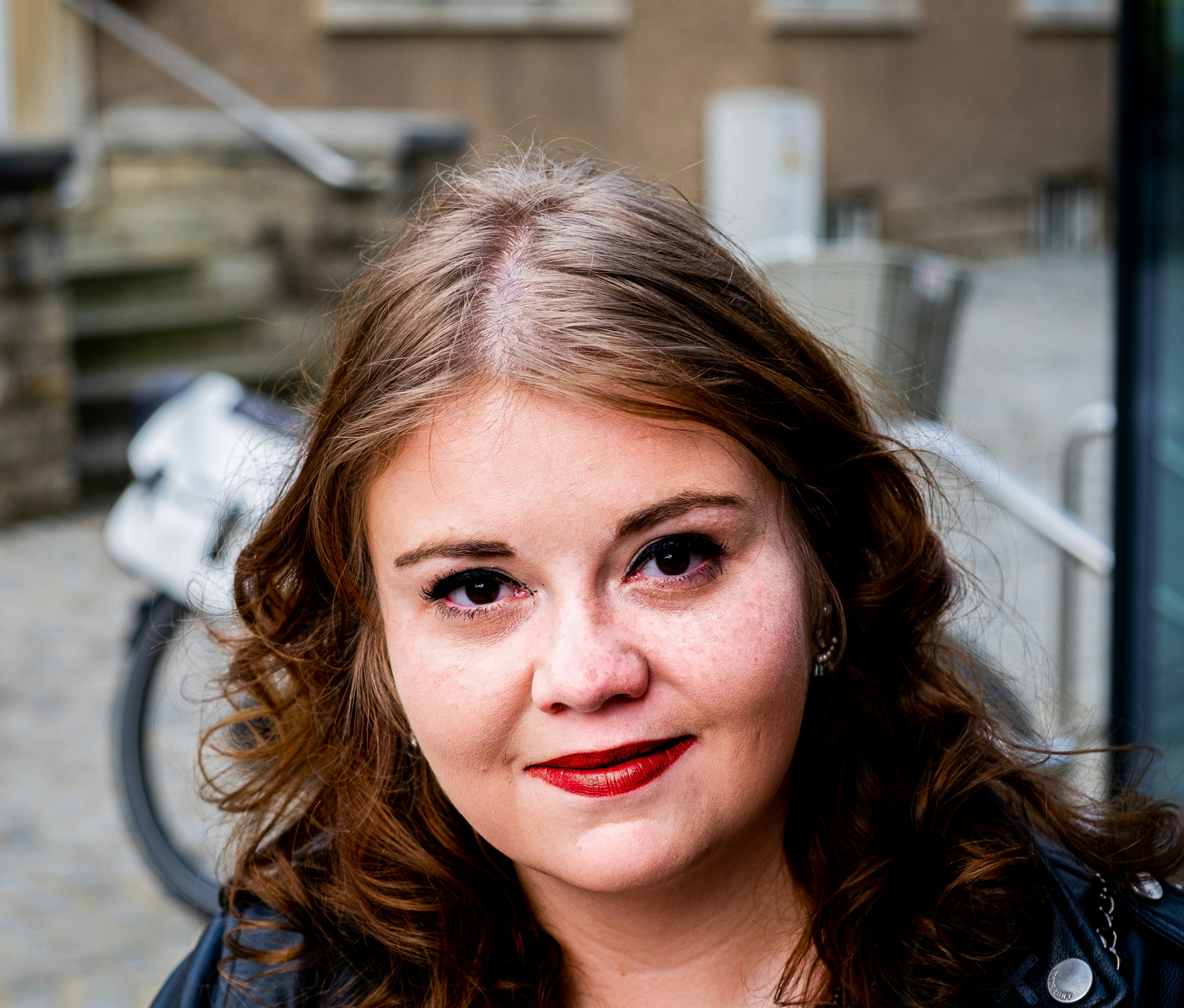 Portrait shot of a guest before a wedding.