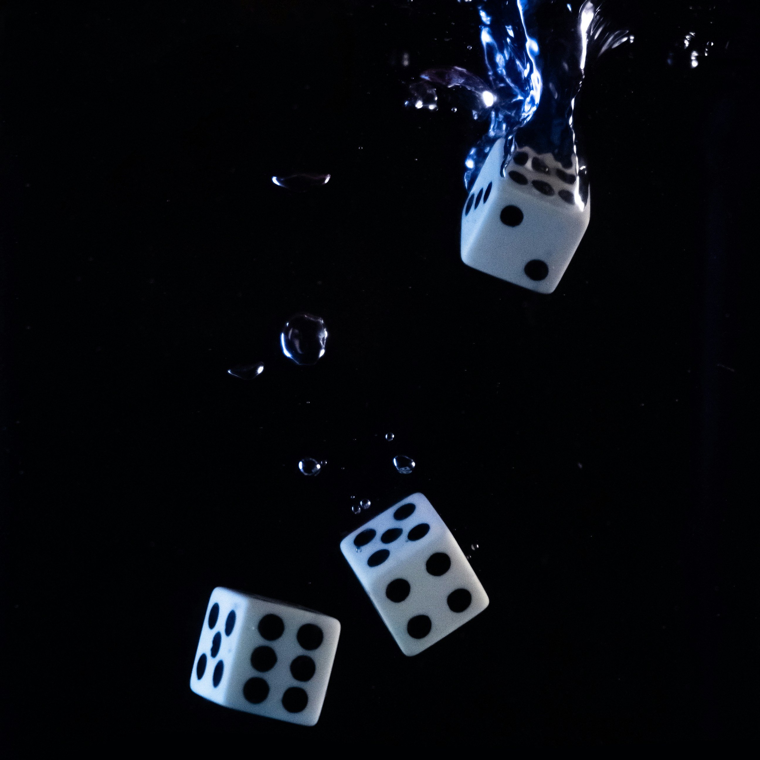Dices thrown into water