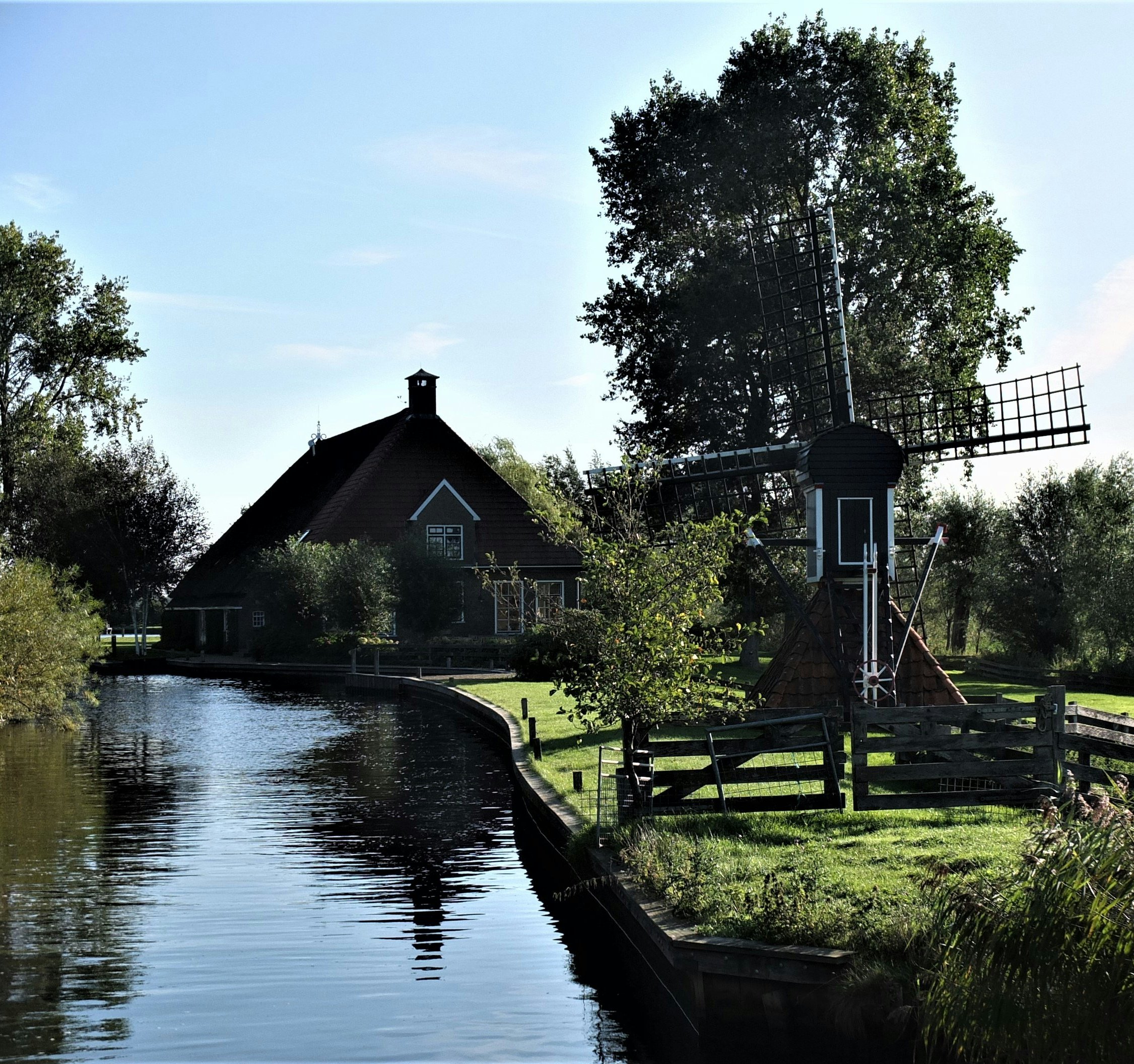 A typical Dutch place, a old Dutch windmill at a farm in Friesland.